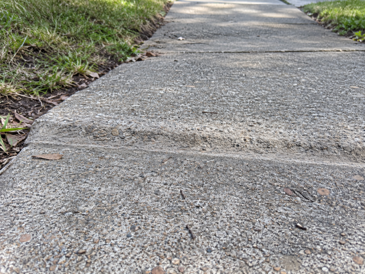 Uneven sidewalk after concrete grinding
